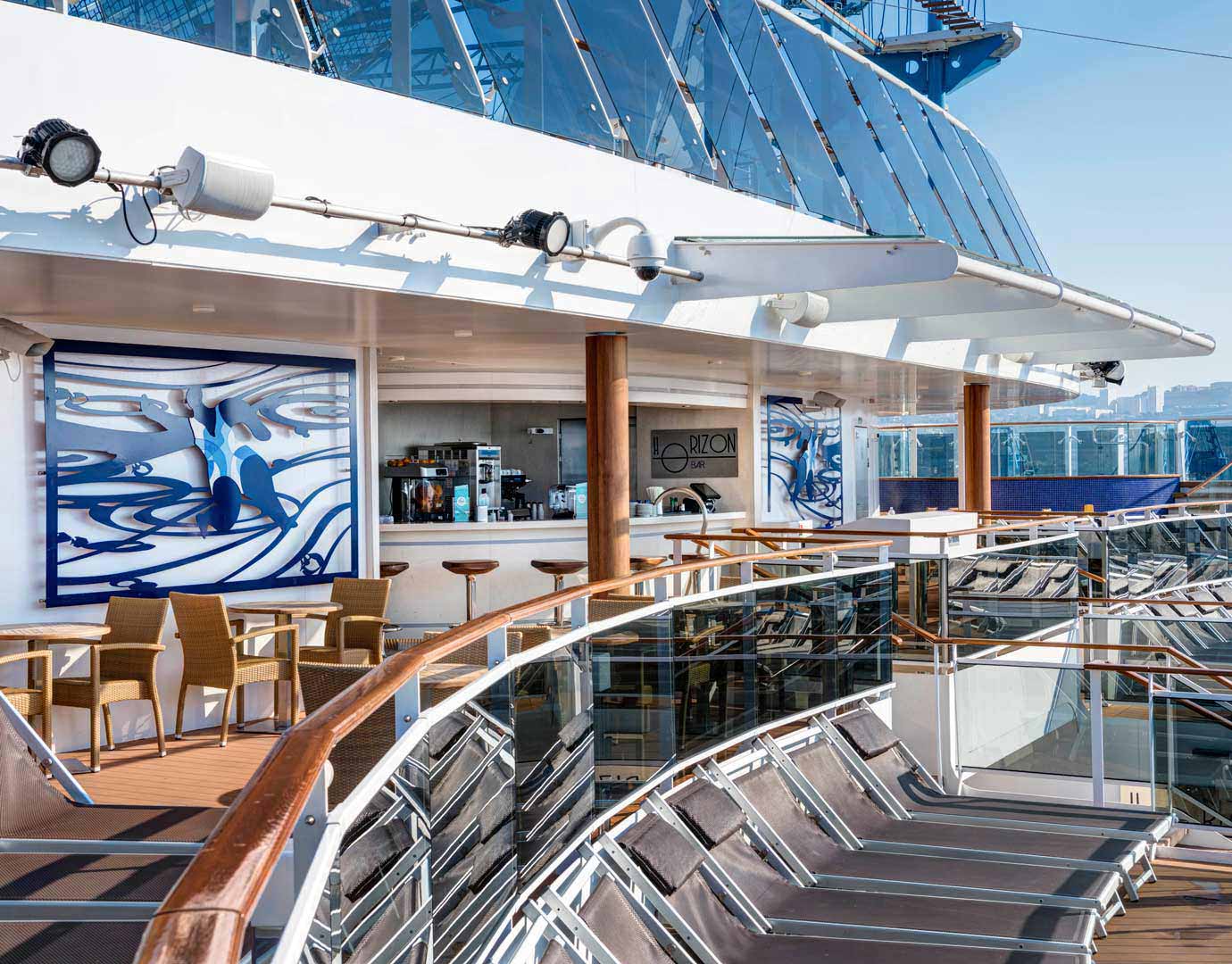 The Horizon Bar on an MSC Cruises ship with outdoor seating and sun loungers overlooking the sea | MSC Cruises
